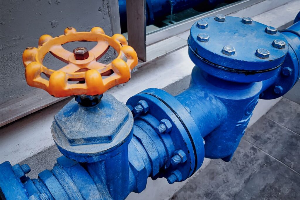 How does pipe diameter affect household water pressure?